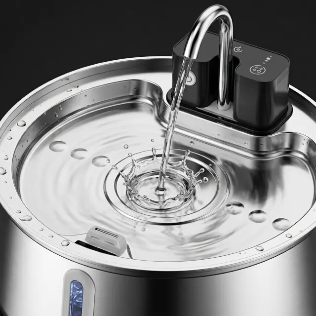 Close-up of the FounTail faucet spout pouring fresh filtered water into the stainless steel bowl
